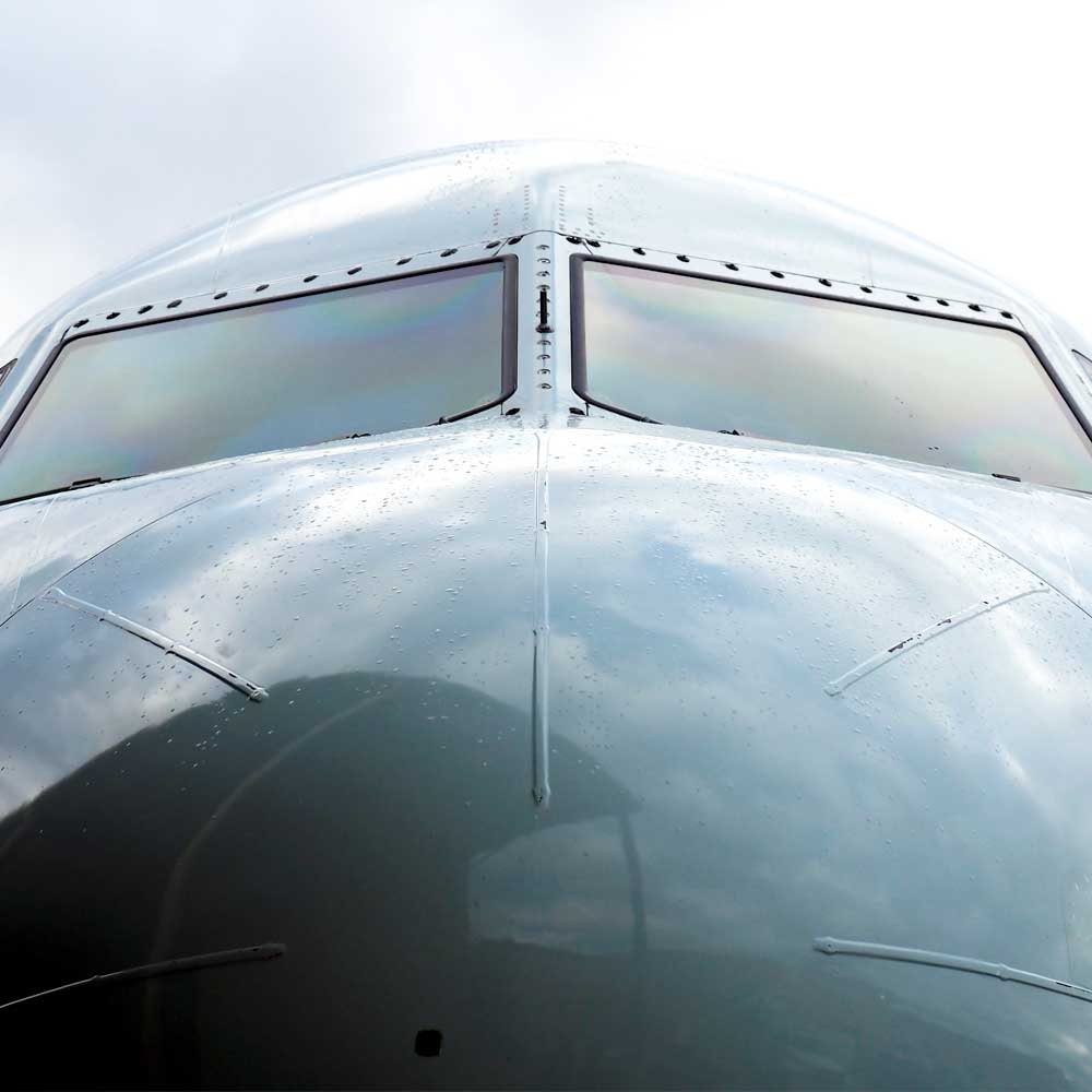 Close-up of the nose of a large airplane.